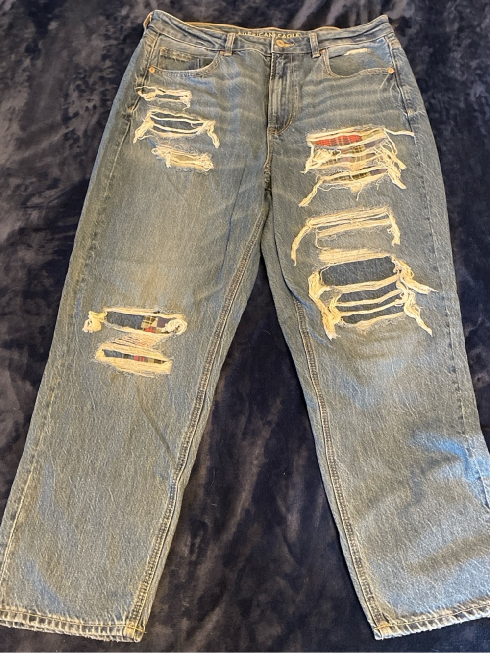 Distressed patched jeans